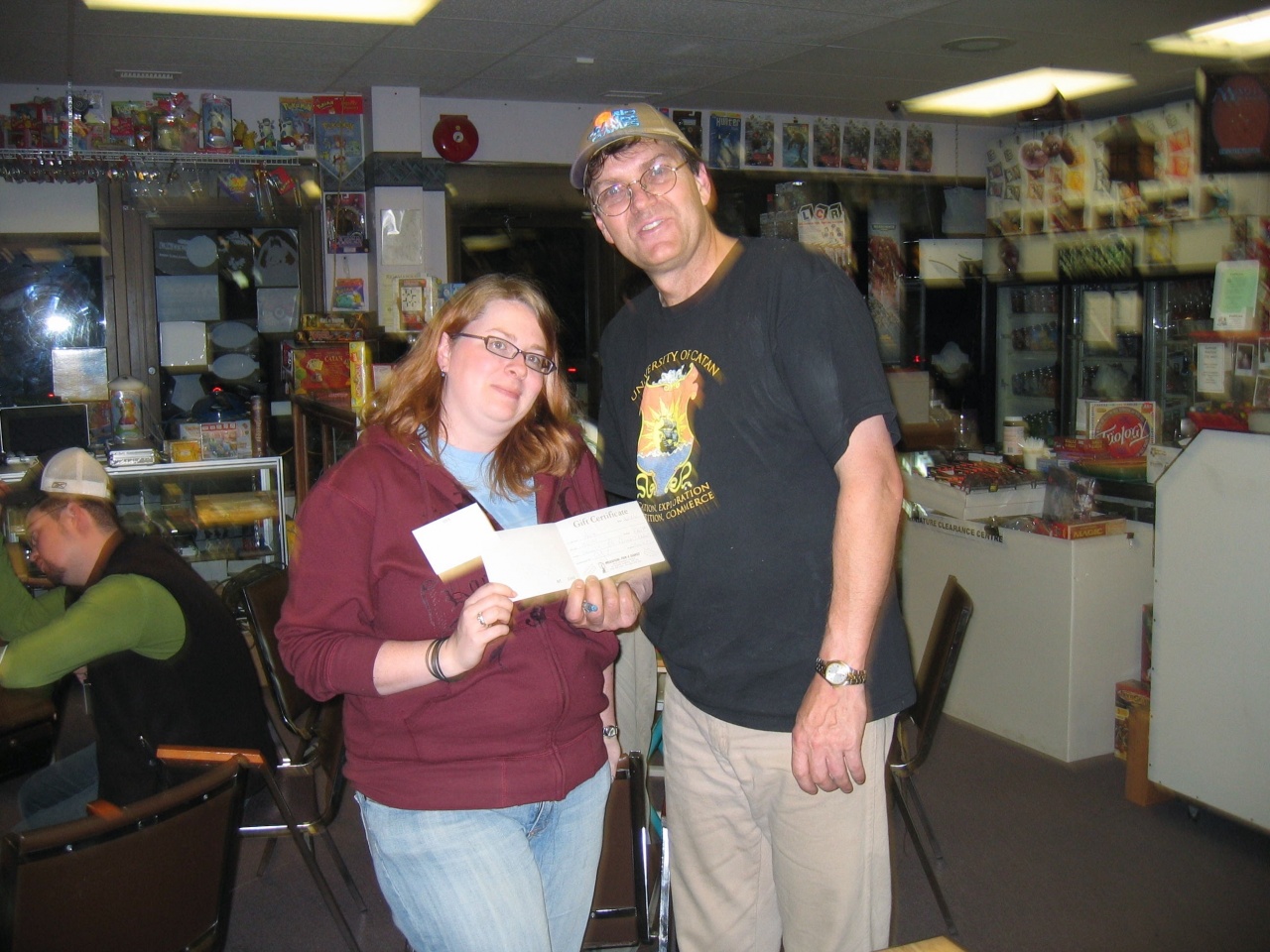 Store Owner presents a in store gift certificate